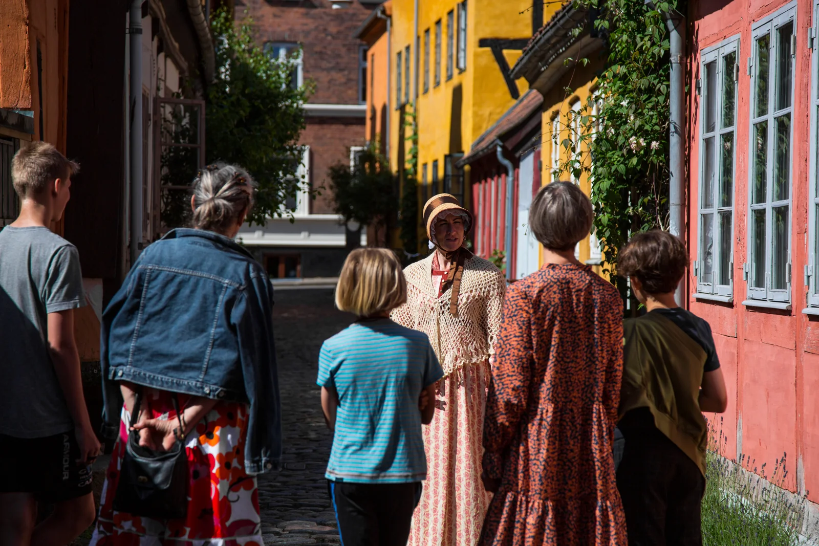 People meet in Helsingør’s historic streets.